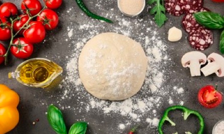 pizza dough on kitchen table