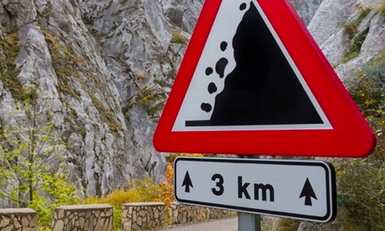 road sign on mountain