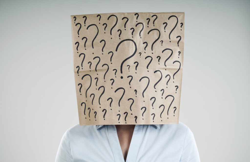 woman wearing a paper bag with questions mark